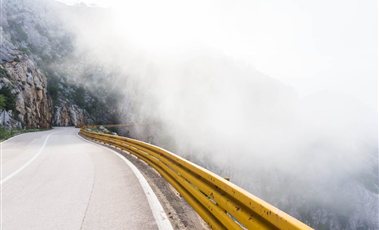Guard Rails & Accessories Yellow steel guard rail along a winding mountain road